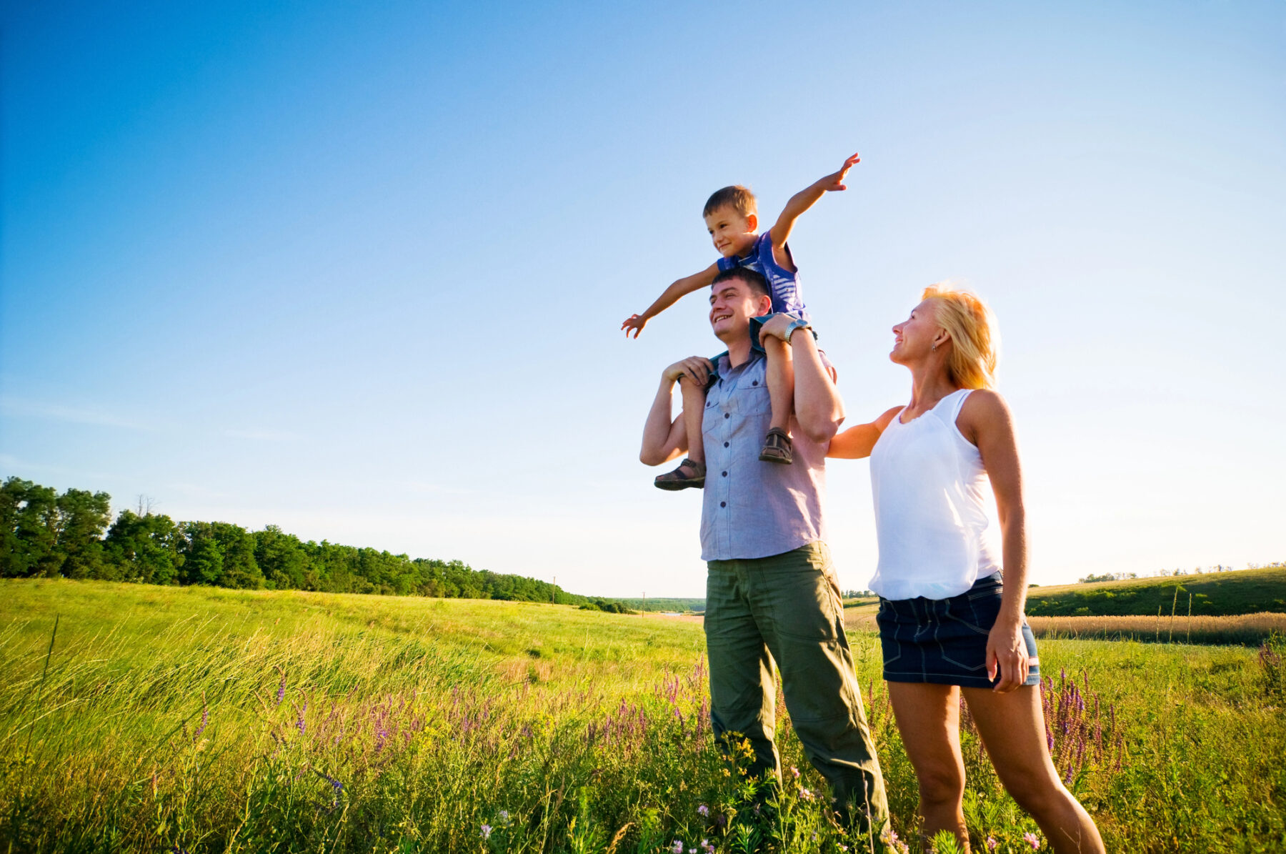 Happy family in nature enjoying their health